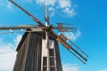 Ancient windmill on the blue sky background