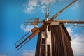 Ancient windmill on the blue sky background