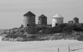 Ancient Windmills in Apulia Beach. Royalty Free Stock Photo