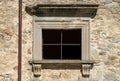 An ancient window with a decaying lintel in Pontremoli Royalty Free Stock Photo