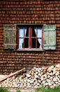 Ancient window on log house wooden wall Royalty Free Stock Photo