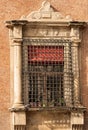 Ancient window with metal grate in Bologna Italy - Accursio Palace Royalty Free Stock Photo