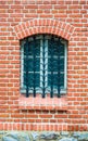 Old window with lattice and brick stones
