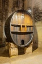 Ancient wine barrel on display in a cellar