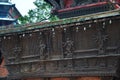 Ancient wood architecture and antique art wooden carved nepalese angel deity god in old ruins building for nepali people foreign Royalty Free Stock Photo