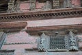 Ancient wood architecture and antique art wooden carved nepalese angel deity god in old ruins building for nepali people foreign Royalty Free Stock Photo