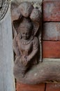 Ancient wood architecture and antique art wooden carved nepalese angel deity god in old ruins building for nepali people foreign Royalty Free Stock Photo