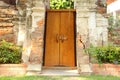 Ancient wood door and broken wall. Royalty Free Stock Photo