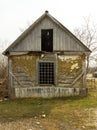 An ancient, wooden and abandoned dilapidated house in a village where no one lives anymore, a retro legacy of the last century.