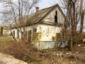 An ancient, wooden and abandoned dilapidated house in a village where no one lives anymore, a retro legacy of the last century.