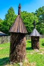 Ancient wooden beehives in old rural apiary Royalty Free Stock Photo