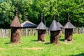 Ancient wooden beehives in old rural apiary Royalty Free Stock Photo