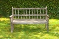 Ancient wooden bench in a garden Royalty Free Stock Photo