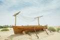 Ancient wooden boat on the sand in the desert Royalty Free Stock Photo