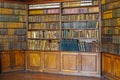 Ancient wooden book shelves with old library books Dusty bookshelf with rare books collection in bookcase Retro library
