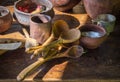 Ancient wooden and clay dishes left on table after dinner