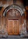 Ancient wooden door. Facade of the temple Armenia.