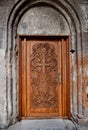 Ancient wooden door. Facade of the temple Armenia.