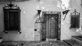 Ancient wooden door with iron bars in Sevilla, Spain