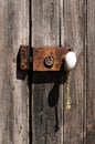 Ancient Wooden Door with a Metal Grungy Lock Royalty Free Stock Photo