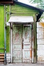 Ancient wooden door in old house wall. Astrakhan, Russia