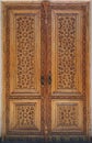 ANCIENT WOODEN DOOR WITH ORNAMENT. Royalty Free Stock Photo