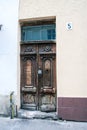 Ancient wooden door with padlock window broken stone step Royalty Free Stock Photo