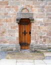 Ancient wooden door set on blocks of stone Royalty Free Stock Photo