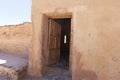 Ancient wooden door in stone castle wall Royalty Free Stock Photo