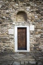 Ancient wooden door in stone castle wall. Royalty Free Stock Photo