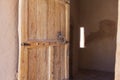Ancient wooden door in stone castle wall Royalty Free Stock Photo