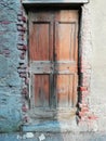 Ancient wooden door in Tuscany Italy Royalty Free Stock Photo