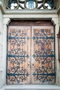 Ancient wooden doors of Church of Sts. Olha and Elizabeth in Lviv, Ukraine. Old medieval wood doorway, soft selective focus Royalty Free Stock Photo