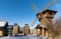 Ancient wooden fortress, a mill and log huts. Russian village in the winter. Russia. Suzdal. Royalty Free Stock Photo