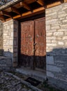 Ancient wooden gate doors in village of Monodendri in Greece Royalty Free Stock Photo