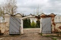 Ancient wooden gate in the fence of an old estate or private property Royalty Free Stock Photo