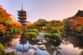 Ancient wooden pagoda Toji temple in autumn garden, Kyoto, Japan. Royalty Free Stock Photo