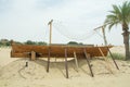 Ancient wooden small ship on the sand in the desert Royalty Free Stock Photo