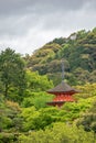 Ancient wooden temple with spring foliage colors at the mountain of Arashiyama, Kyoto, Japan Royalty Free Stock Photo