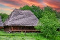 ancient wooden Ukrainian hut against the sky