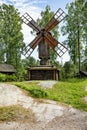 Ancient wooden windmill in forest Royalty Free Stock Photo