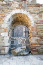 Ancient wooden window of medieval brick wall Royalty Free Stock Photo