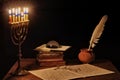 Ancient writer`s working desk with menorah Royalty Free Stock Photo