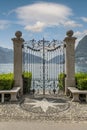 Ancient wrought iron gate overlooking Lake Lugano, Switzerland, in the Ciani park Royalty Free Stock Photo