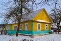 Ancient yellow and green wooden traditional russian house. Vintage village of Belarus Royalty Free Stock Photo