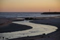 Mouth of the Ancora river in the atlantic ocean at sunset. Beach of Vila Praia de Ancora. Municpality of Caminha, Portugal. Royalty Free Stock Photo