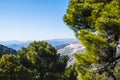 Andalusian mountain scenery with rolling hills olive groves and farms under a blue sky in southern spain Royalty Free Stock Photo