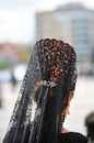 Andalusian woman with mantilla and back comb, Holy Week in Seville, Andalusia, Spain