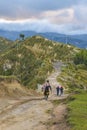 Andean Natives Walking at Road Quilotoa Ecuador