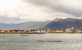 Andenes village panorama with multiple houses and mountains in the background, Lofoten islands, Andoy Municipality, Vesteralen